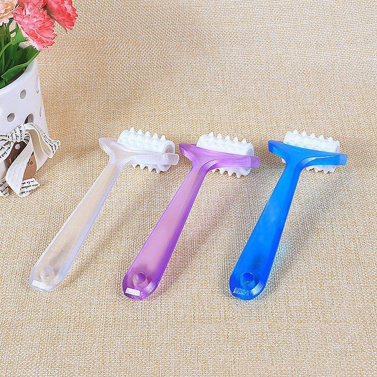 Small plastic roller face massager